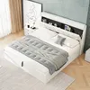 A white upholstered bed with a storage headboard is shown in a bedroom setting. Anteprima dell’immagine prodotto