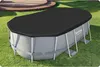 An oval swimming pool cover is shown on top of an above-ground pool in a grassy backyard. Produktbild-Vorschau
