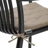 A close-up of a cushion tied to a black chair. Produktbild-Vorschau
