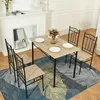 A dining set with a table and four chairs placed on a rug in front of a fireplace. Náhled obrázku produktu