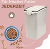 A dog food storage container with dog food and treats depicted around it. Produktbild-Vorschau