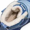 A close-up view of the inside of a blue winter boot with white fluffy lining. Produktbild-Vorschau