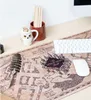A desk setup featuring a Harry Potter themed mousepad, keyboard, mouse, and desk accessories. Náhľad obrázku produktu