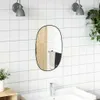 A bathroom scene with a mirror, sink, faucet, and wall tiles. Produktbild-Vorschau