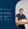 A woman is using a blood pressure monitor on her arm, with product features listed on the left side of the image. Produktbild-Vorschau