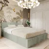 A bedroom with a bed, wardrobe, and decorative wallpaper. Produktbild-Vorschau