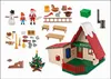 A collection of PLAYMOBIL Christmas-themed toys, including figures, a house, a Christmas tree, and accessories, arranged on a white background. Produktbild-Vorschau