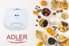 A white waffle maker is shown on the left side of the image, with a variety of breakfast foods arranged on a white wooden surface on the right. Anteprima dell’immagine prodotto
