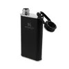 A black Stanley flask with its cap open, shown from a diagonal angle against a white background. Podgląd zdjęcia produktu