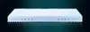 A white mattress with a grooved surface and perforated sides is shown against a dark, gradient background. Produktbild-Vorschau