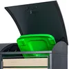 A close-up view of a dark grey trash bin enclosure with its lid open, revealing a bright green trash bin inside. The enclosure has wooden slats on the front. Produktbild-Vorschau
