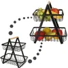 A two-tiered fruit basket with a wooden handle, shown filled with various fruits. Produktbild-Vorschau