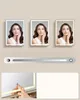 Three images of a woman in a mirror, showing different lighting options, with a slider control below and a close-up of a hand touching a mirror. Produktbild-Vorschau