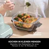 A person is using a Ninja CRISPi air fryer to prepare a meal of salmon and vegetables. Anteprima dell’immagine prodotto