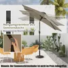 An outdoor patio scene with a patio umbrella, chairs, and plants. Náhled obrázku produktu