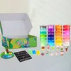 A slime making kit with various colored slimes, accessories, and a decorative diorama. Voir les images du produit