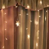 A string of snowflake-shaped LED lights hangs in front of draped curtains. Produktbild-Vorschau