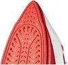 Close-up view of the sole of a red and white iron. Produktbild-Vorschau