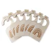 A set of wooden baby clothing size dividers with rainbow designs and size numbers. Produktbild-Vorschau