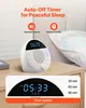 A white noise machine is shown on a bedside table, with a pillow in the background. A graphic overlay highlights features. Náhľad obrázku produktu