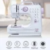 A white and purple sewing machine is displayed against a blurred background of a room. Produktbild-Vorschau