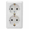 A close-up, front-facing studio shot of a white, two-gang electrical outlet mounted on a white surface. Produktbild-Vorschau