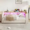 A beige sofa bed with integrated LED lighting and storage, set up in a bedroom or living room. Anteprima dell’immagine prodotto