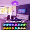 A couple relaxing on a couch in a modern living room, with a ceiling light and speaker above them. Produktbild-Vorschau