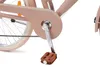 A close-up view of a bicycle's crankset and pedals. Podgląd zdjęcia produktu