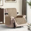 A recliner chair with protective covers on the seat, back, and armrests. Anteprima dell’immagine prodotto