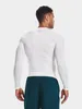 A man wearing a white long-sleeved shirt and dark shorts, viewed from the back. Produktbild-Vorschau