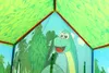 Interior view of a children's play tent with dinosaur and jungle graphics. Náhled obrázku produktu