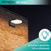 A modern outdoor wall light with a motion sensor is mounted on a textured stone wall at night. Produktbild-Vorschau