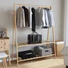A wooden garment rack with clothes and storage bins. Náhled obrázku produktu