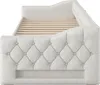 A side view of a beige upholstered daybed with a slatted wooden mattress base. Voir les images du produit
