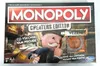 The image shows the box of the Monopoly Cheaters Edition board game. Náhled obrázku produktu