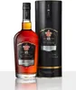 A bottle of Havana Club Añejo 15 Años Gran Reserva rum and its gift box, presented on a reflective white surface. Produktbild-Vorschau