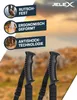 A close-up of two black walking sticks with a blurred background of a natural landscape. Produktbild-Vorschau
