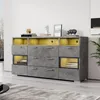 A modern gray sideboard with yellow interior lighting, displayed in a well-lit room. Anteprima dell’immagine prodotto