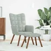 A living room setting with a chair and ottoman.