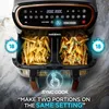 A close-up marketing image of a dual-chamber air fryer with french fries in both baskets, highlighting the 'Sync Cook' feature. Produktbild-Vorschau