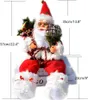 A decorative Santa Claus figurine with size measurements indicated. Náhľad obrázku produktu