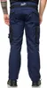 A person wearing navy blue work pants with black accents. Produktbild-Vorschau