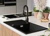 A modern kitchen sink and faucet setup on a countertop. Produktbild-Vorschau