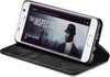 A Samsung Galaxy S7 edge smartphone in a black flip case, displaying a movie poster on its screen. Produktbild-Vorschau
