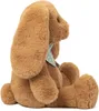 A side view of a brown plush bunny toy sitting down, wearing a light blue polka dot bandana. Produktbild-Vorschau