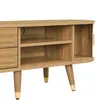 A close-up view of a wooden TV stand with golden accents. Produktbild-Vorschau