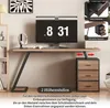 A desk setup with a monitor, headphones, and a drawer unit, showcasing product features. Anteprima dell’immagine prodotto