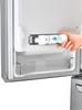 A hand is inserting a water filter into a refrigerator. Náhled obrázku produktu