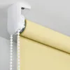 Close-up of a roller blind mechanism and the rolled-up fabric. Produktbild-Vorschau